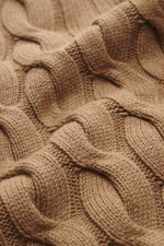 Close-up perspective of the Moorer Cashmere-silk cardigan 'Dean' light brown, showing its classic cable knit design, medium fine knit pattern, mix of cashmere and silk, very soft feel, slim fit, two-way zipper, ribbed stand-up collar, and flexible ribbed 