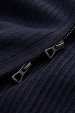 Close-up front view of Polo Ralph Lauren Cardigan navy mottled showing fine, pure cotton rib knit fabric and double zip with "POLO" engraving.

Description: <p>Timeless knit basic: With this cardigan in pure cotton, POLO RALPH LAUREN has created a versati