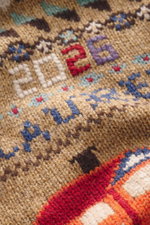 Close-up front view of Polo Ralph Lauren Cardigan light brown/multicolor patterned showing intarsia knit details with "2026" and textured wool fabric.

Description: <p>With this patterned cardigan made of pure wool in intarsia knit, POLO RALPH LAUREN offe