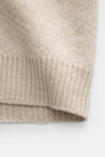 Close-up front view of 04651/ A trip in a bag Cardigan beige/sand patterned showing rib knit made of wool and cashmere, soft feel, medium-fine knit texture, subtle Norwegian pattern, Regular Fit, V-neck, four-button placket, and comfortable ribbed cuffs.