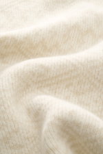 Close-up front view of the 04651/ A trip in a bag Cardigan cream/beige patterned, rib knit made of wool and cashmere with a soft feel, medium-fine knit texture, subtle Norwegian pattern, Regular Fit, V-neck, four-button placket, and comfortable ribbed cuf