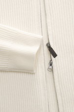 Close-up front view of the von Braun Cashmere Cardigan off-white showing soft ribbed knit fabric, two-way zipper, and elastic cuffs.