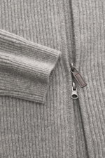 Close-up front view of the von Braun Cashmere Cardigan light grey melange showing ribbed knit, two-way zipper, and elastic cuff. Basic for the cold season made from soft cashmere: The VON BRAUN cardigan in classic ribbed knit can be elegantly combined wit