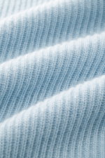 Close-up, front-facing macro shot of the light blue von Braun Cashmere Cardigan showing soft pure cashmere ribbed knit texture. Basic for the cold season made from soft cashmere: The VON BRAUN cardigan in classic ribbed knit can be elegantly combined with