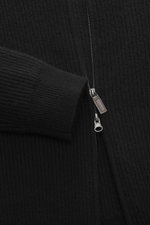 Close-up front view of the von Braun Cashmere Cardigan black showing soft pure cashmere ribbed knit, two-way zipper, elastic cuffs.