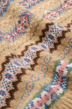 Close-up front view of Polo Ralph Lauren Sweater vest beige patterned with cotton and wool blend, soft medium-fine knit, slim fit V-neck, elasticated ribbed bands, and colorful patterned knit. <p>With this patterned sweater vest made of cotton and wool, P