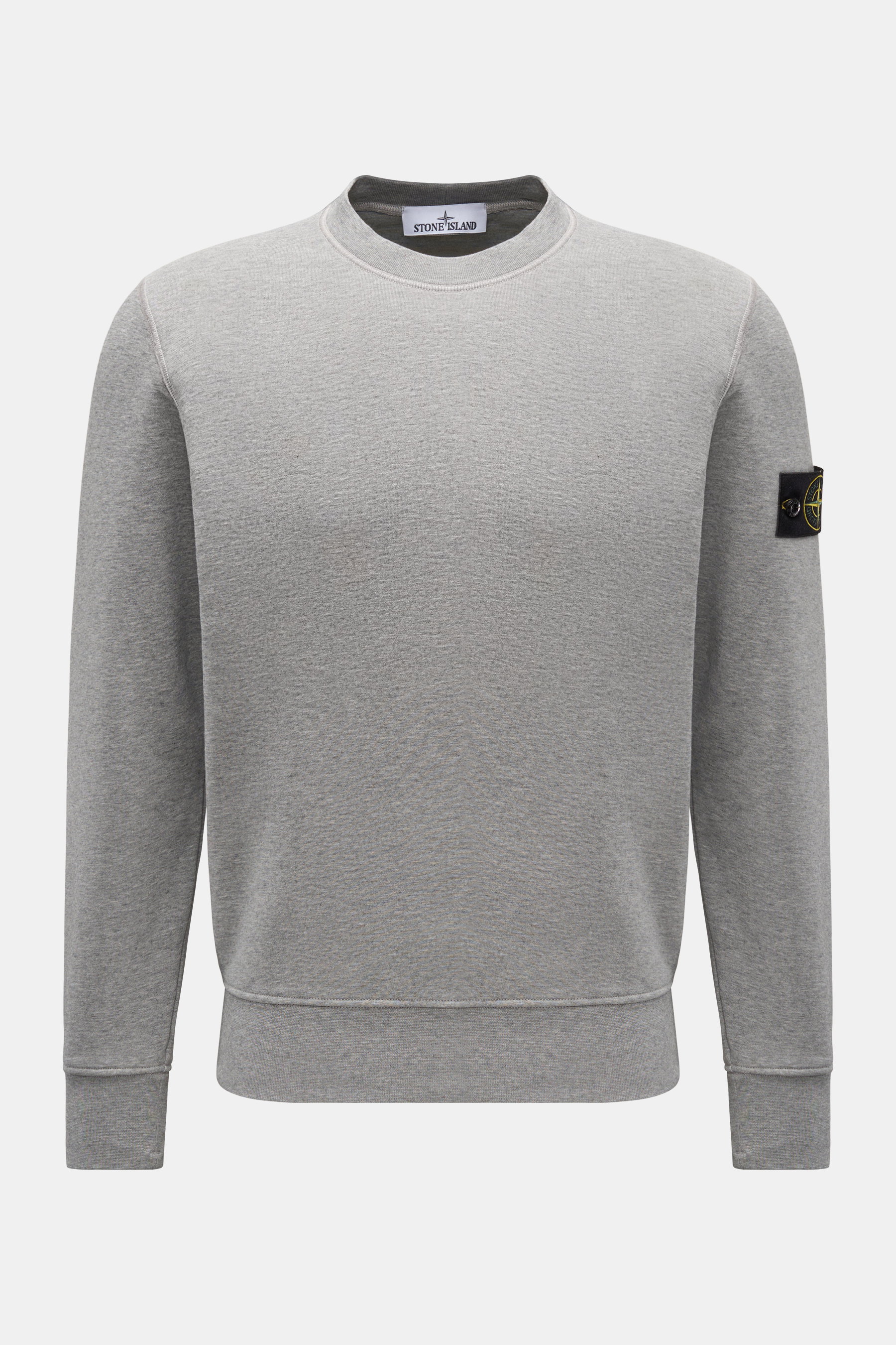 Stone Island Crew neck sweatshirt grey mottled shown from the front, sweat made of pure cotton, soft feel, distinctive seam finish, garment-dyed, slim fit, crew neck, signature compass badge on left sleeve, sweat fabric inside, comfortable ribbed bands.