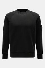 Stone Island Crew neck sweatshirt 'Ghost Piece' black shown front view, pure cotton, lightweight fabric, regular fit, crew neck, raglan sleeves, tonal compass badge on upper sleeve, ribbed bands. 

A timeless basic piece: This sporty sweatshirt from the '