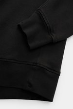 Close-up view of the cuff and hem of the Stone Island Crew neck sweatshirt 'Ghost Piece' black, showing ribbed bands and stitching detail.

Description: <p>A timeless basic piece: This sporty sweatshirt from the 'Ghost' Capsule Collection by STONE ISLAND 
