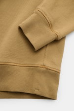 Alt tag (125 characters max): Close-up front view of Stone Island Crew neck sweatshirt 'Ghost Piece' light brown cuff and hem details in soft cotton fabric.

Description:
<p>A timeless basic piece: This sporty sweatshirt from the 'Ghost' Capsule Collectio