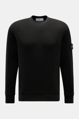 Front view of Stone Island Rundhalspullover 'Waffle' schwarz, a black slim fit crewneck sweater with waffle knit texture and compass badge on upper arm.

Description:  
<p>Basic Piece mit Twist: Dieser Pullover im Waffelstrick von STONE ISLAND wird zur id