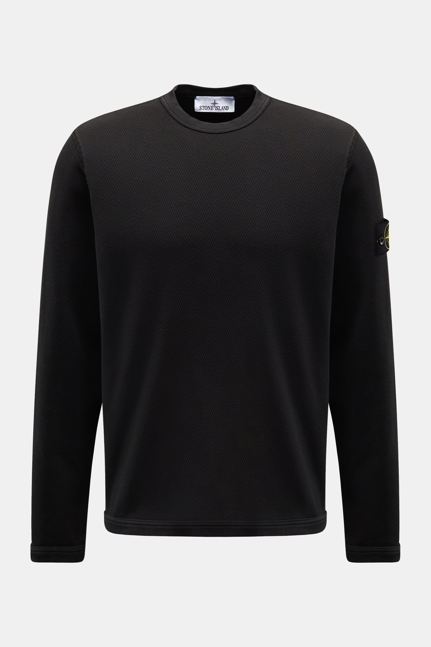 Stone Island Rundhalspullover schwarz, frontale Ansicht, reine Baumwolle, strukturierte Jersey-Qualität, Overlock-Nähte, Kompass-Badge am Oberarm, elastische Bündchen.