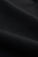 Alt tag (125 characters max): Close-up angled view of fabric texture of Stone Island long sleeve black in heavy cotton jersey with soft feel.

Description: <p>With this crew neck long sleeve in heavy cotton jersey with compass badge on the sleeve, STONE I