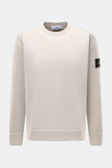 Stone Island Long sleeve light grey crew neck sweatshirt photographed from the front, made of heavy cotton jersey with a compass badge on the left sleeve.

<p>With this crew neck long sleeve in heavy cotton jersey with compass badge on the sleeve, STONE I