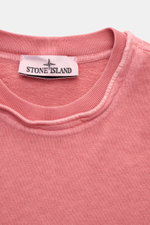 Close-up front view of Stone Island Crew neck sweatshirt 'Washed Sweat' antique pink, showing the collar with external seams and the Stone Island label.

Description: <p>STONE ISLAND’s signature piece dyeing is used with a modern washed effect in this swe