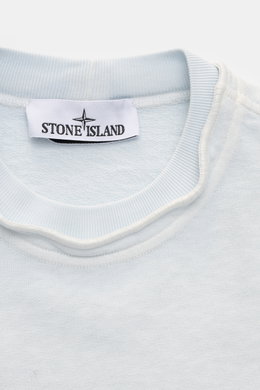 Close-up front view of Stone Island Crew neck sweatshirt 'Washed Sweat' pastel blue showing crew neck with seam and Stone Island label.

<p>STONE ISLAND’s signature piece dyeing is used with a modern washed effect in this sweatshirt and external seams on 