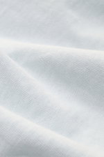 Close-up fabric texture of Stone Island Crew neck sweatshirt 'Washed Sweat' pastel blue, showing soft pure cotton with a modern washed effect and detailed seams.

Description: <p>STONE ISLAND’s signature piece dyeing is used with a modern washed effect in