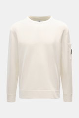 C.P. Company Rundhals-Sweatshirt creme, frontale Nahaufnahme, reine Baumwolle, garment dyed, Druckknopf-Tasche am Oberarm, Rippbündchen