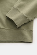 Close-up of the sleeve and ribbed cuff of the Canada Goose Sweatshirt 'Loon' grey green, photographed from above.

Description: <p>Comfort 24/7 offers the lightweight 'Loon' sweatshirt made of pure cotton by CANADA GOOSE, which complements your casual war