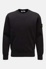 Stone Island Crew Neck Sweatshirt 'Basic Sweat' black shown from the front, made of pure cotton with a soft touch, regular fit, crew neckline, compass badge on the upper arm, and ribbed cuffs. Timeless Basic Piece: The sporty STONE ISLAND sweatshirt is th