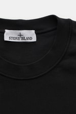 Close-up front view of Stone Island Crew Neck Sweatshirt 'Basic Sweat' black showing crew neckline and brand label.

<p>Timeless Basic Piece: The sporty STONE ISLAND sweatshirt is the ideal foundation for casual leisure looks and evolves into a versatile 