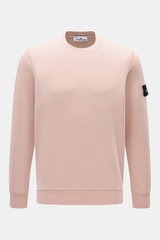 Front view of Stone Island Crew Neck Sweatshirt 'Basic Sweat' rose in soft rose color, made of pure cotton with regular fit, crew neckline, ribbed cuffs, and compass badge on upper arm. Timeless basic piece ideal for casual leisure looks and versatile all
