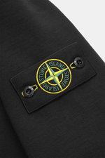 Stone Island Sweat Longsleeve-Poloshirt schwarz, Detailaufnahme der Ärmelnaht mit klassischem Kompass-Badge, Baumwolle, Regular Fit.