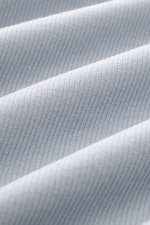 Close-up of ribbed knit fabric in smoky blue, photographed from a detailed side angle, showing texture and softness of the Stone Island R-Neck Longsleeve smoky blue.

<p>Autumn essential: The long sleeve by STONE ISLAND combines characteristic ribbed knit