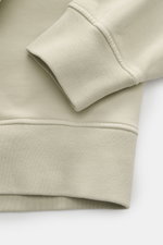 Close-up of the sleeve and hem of the Stone Island Sweatshirt 'Print' beige, showing soft cotton fabric and ribbed cuffs from a top-down perspective.

Description: 
<p>Casual comfort meets iconic design: With this sweatshirt, STONE ISLAND presents a cool 