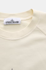 Close-up front view of Stone Island Sweatshirt 'Print' cream showing crew neckline, raglan sleeves, and Stone Island label.

Description: 
<p>Casual comfort meets iconic design: With this sweatshirt, STONE ISLAND presents an essential piece for your casua