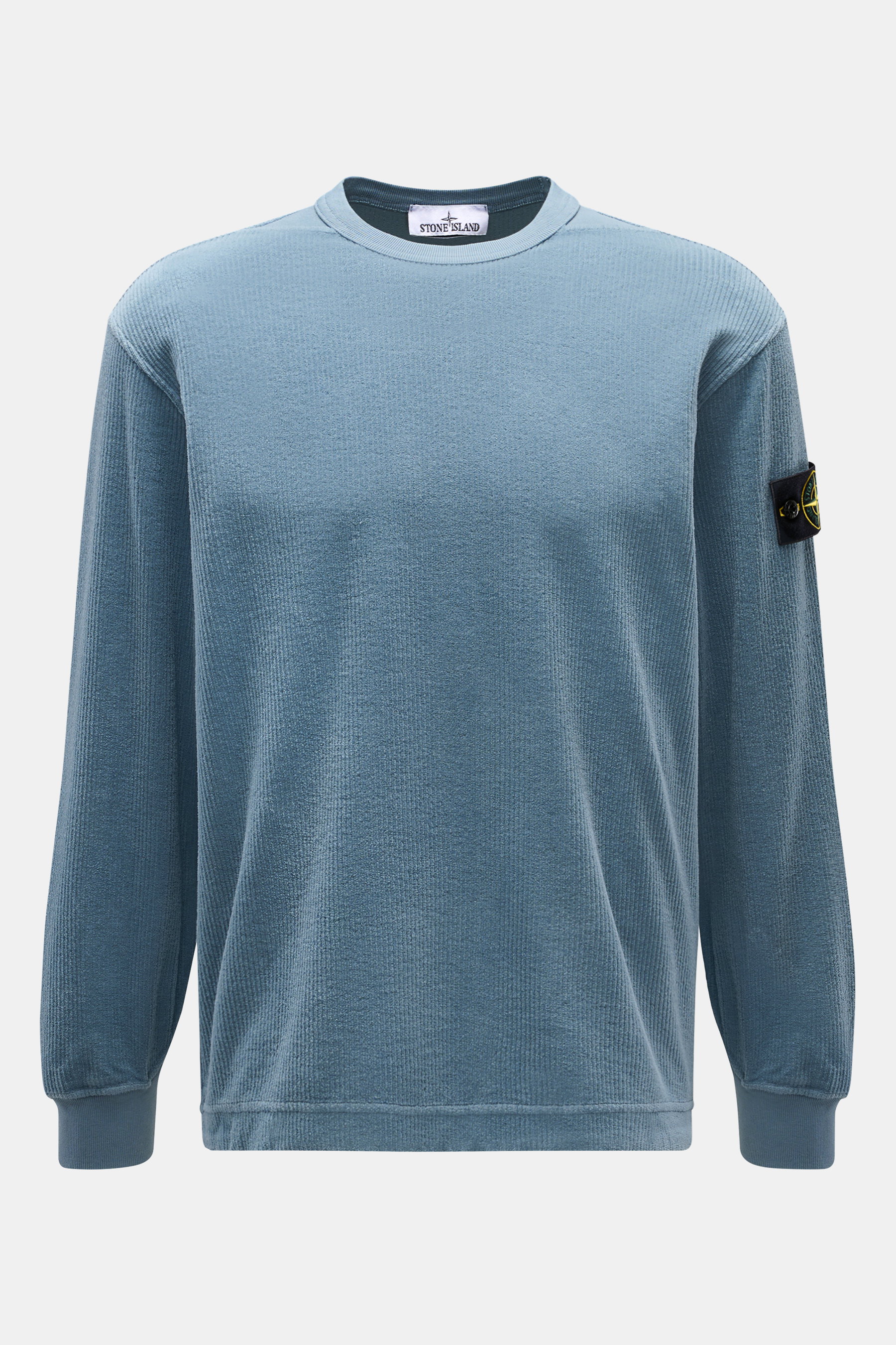 Front view of Stone Island Corduroy Sweatshirt Smoky Blue in pure cotton corduroy with ribbed crew neckline, cuffs, and compass badge on sleeve.

Description: <p>This sweatshirt from STONE ISLAND is made from pure cotton corduroy, giving it a special twis