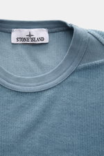 Close-up front view of the Stone Island Corduroy Sweatshirt Smoky Blue neckline showing soft pure cotton corduroy fabric and ribbed collar.

<p>This sweatshirt from STONE ISLAND is made from pure cotton corduroy, giving it a special twist – perfect to com