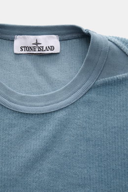 Close-up front view of the Stone Island Corduroy Sweatshirt Smoky Blue neckline showing soft pure cotton corduroy fabric and ribbed collar.

<p>This sweatshirt from STONE ISLAND is made from pure cotton corduroy, giving it a special twist – perfect to com