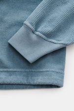 Close-up view of the Stone Island Corduroy Sweatshirt Smoky Blue sleeve and cuff, showing pure cotton corduroy texture and ribbed cuff details.

Description: <p>This sweatshirt from STONE ISLAND is made from pure cotton corduroy, giving it a special twist