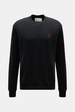 Front view of Ami Paris Crewneck Sweatshirt black, made of pure cotton with soft touch, regular fit, crew neckline, red logo stitching on chest, and ribbed cuffs.  

<p>Comfortable basic: The AMI PARIS sweatshirt made of pure cotton is the ideal companion