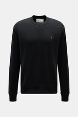 Front view of Ami Paris Crewneck Sweatshirt black, made of pure cotton with soft touch, regular fit, crew neckline, red logo stitching on chest, and ribbed cuffs.  

<p>Comfortable basic: The AMI PARIS sweatshirt made of pure cotton is the ideal companion