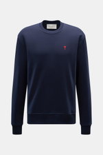 Front view of Ami Paris Crewneck Sweatshirt navy in pure cotton, regular fit with crew neckline, soft touch, logo stitching on chest, and ribbed cuffs. 

Description: <p>Comfortable basic: The AMI PARIS sweatshirt made of pure cotton is the ideal companio