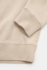 Close-up view of the sleeve and hem of the Maison Kitsuné Beige Melange Sweatshirt, showcasing its soft pure cotton fabric and ribbed cuff.

<p>Cool essential from MAISON KITSUNÉ: With the typical fox patch on the chest, this sweater becomes a favorite pi