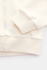 04651/ A trip in a bag Rundhals-Sweatshirt creme, Nahaufnahme von Ärmel und Saum, Jersey aus Wolle und Baumwolle, soft, Slim Fit, Rundhalsausschnitt, elastische Bündchen, inside-Out Design.