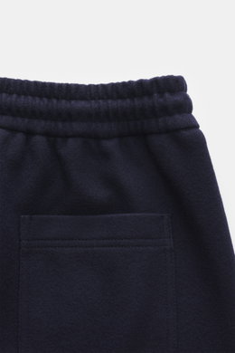 Close-up top-back view of Circolo 1901 Wool Jogpants navy showcasing elastic waistband, patch back pocket, soft wool jersey fabric.