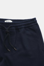 Close-up front view of the elastic waistband and drawstring of Circolo 1901 Wool Jogpants navy, made of pure wool jersey, regular fit, straight cut with side seam and patch back pockets, casual sophistication for modern smart-casual looks.