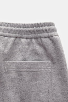 Close-up rear view of Circolo 1901 Wool Jogpants grey melange showing elastic waistband, patch back pocket, and soft wool jersey fabric.