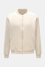Front view of the 04651/ A trip in a bag Sweatjacke 'CL Bomber' creme, a relaxed sweatshirt jacket made from a mix of organic cotton and linen, featuring a garment-dyed finish, oversized fit, robust two-way zipper, typical blouson collar, slanted welt poc