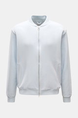 Front view of the 04651/ A trip in a bag Sweatjacke 'CL Bomber' pastellblau, a pastel blue oversized bomber jacket made from a mix of organic cotton and linen with a soft feel, garment-dyed finish, robust two-way zipper, typical blouson collar, slanted we