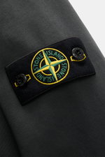 Close-up, angled view of the Stone Island Sweatshirt Jacket Dark Grey showing the embroidered compass badge on soft, garment-dyed cotton fabric.

Additional description:  
<p>Relaxed basic by STONE ISLAND: With sporty casualness, the garment-dyed sweatshi