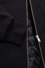 Moose Knuckles Sweatjacke 'Classic Bunny' schwarz, Nahaufnahme von Reißverschluss, Rippbündchen und gesteppter Futterstoff mit leichter Wattierung.