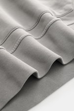 Close-up front view of Stone Island Hoodie grey showing soft pure cotton fabric, ribbed cuffs, and seam details, garment dyed.

Description: 
<p>Timeless casualwear: The hoodie by STONE ISLAND is an indispensable companion for cooler days with its versati