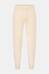 Front view of von Braun Cashmere jogger pants cream showcasing a high waist, tapered fit, elasticated waistband with drawstring, angled hip pockets, and soft pure cashmere knit.

<p>VON BRAUN focuses on sporty comfort with these soft, warm cashmere jogg
