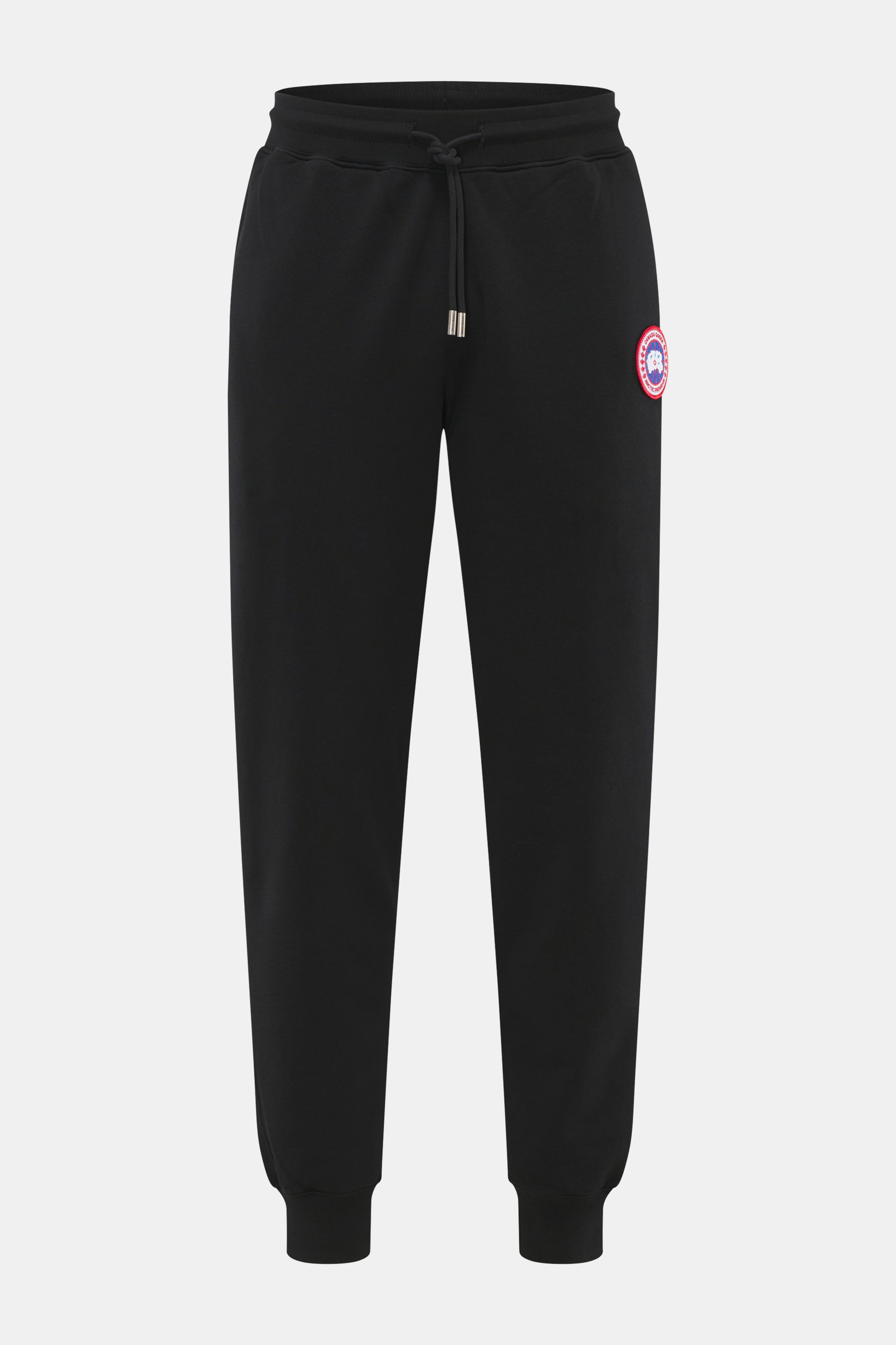 Frontansicht der Canada Goose Sweathose 'Huron' schwarz aus reiner Baumwolle, slim fit, schmal zulaufend, elastischer Bund mit Tunnelzug, Rippbündchen, Weblabel und verdeckter Zipper-Gesäßtasche.