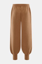 Front view of Ami Paris Merino jogpants light brown made of pure merino wool, soft touch, loose fit, high elastic waistband with drawstring, leather logo detail, ribbed cuffs, and side pockets.